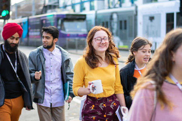 Young people smiling and walking