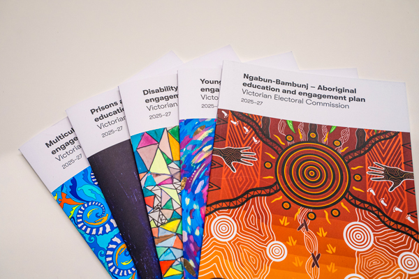 The 5 engagement reports fanned out, with Ngabun-Bambunj (Aboriginal education and engagement plan) on the top. This report features an artwork by Wurundjeri, Dja Dja Wurrung, Ngurai illum Wurrung, German and Irish artist Ky-ya Nicholson Ward.