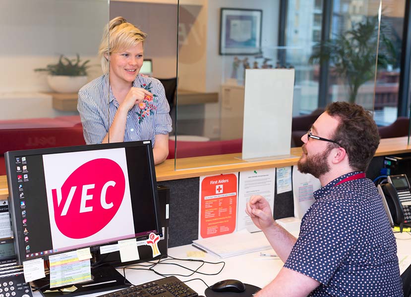 VEC receptionist talks to the member of the public
