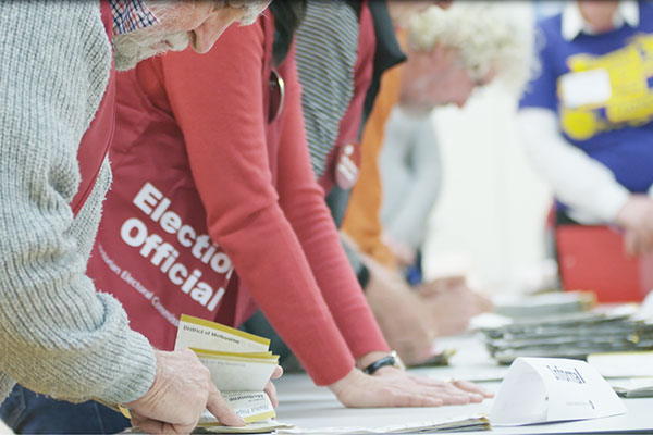 Election officials counting votes on election day